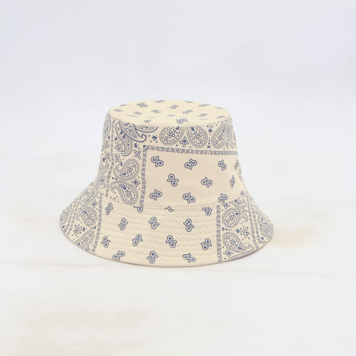Ondine reversible Bandana Bucket Hat UPF 45+ in cream with navy paisley print