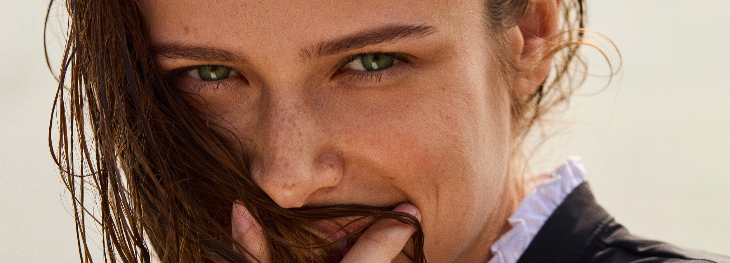 Woman wearing Ondine UPF sun-protective clothing, representing modern skincare and effortless daily sun protection.